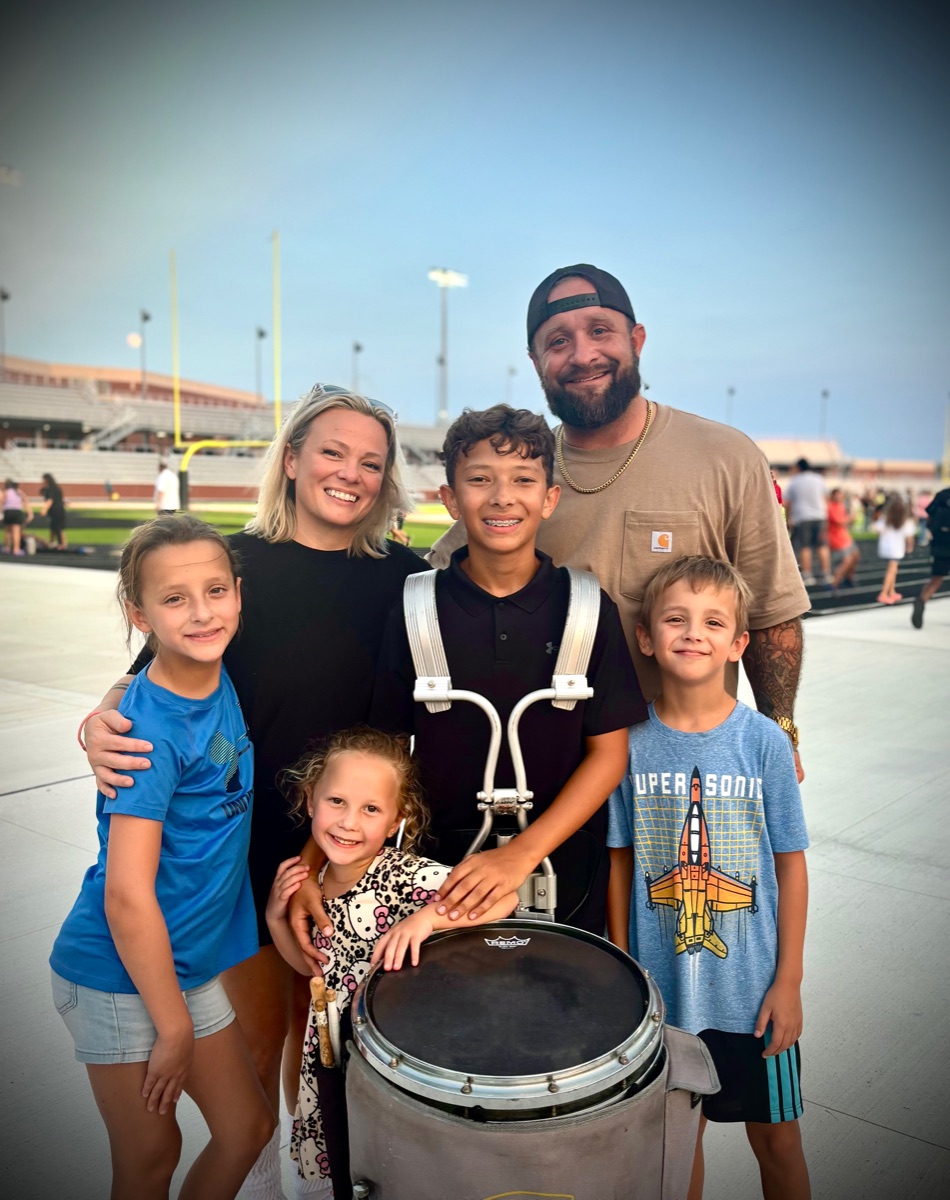 Robb and Ashlee Gandy, owners of Recon Roofing, with their family