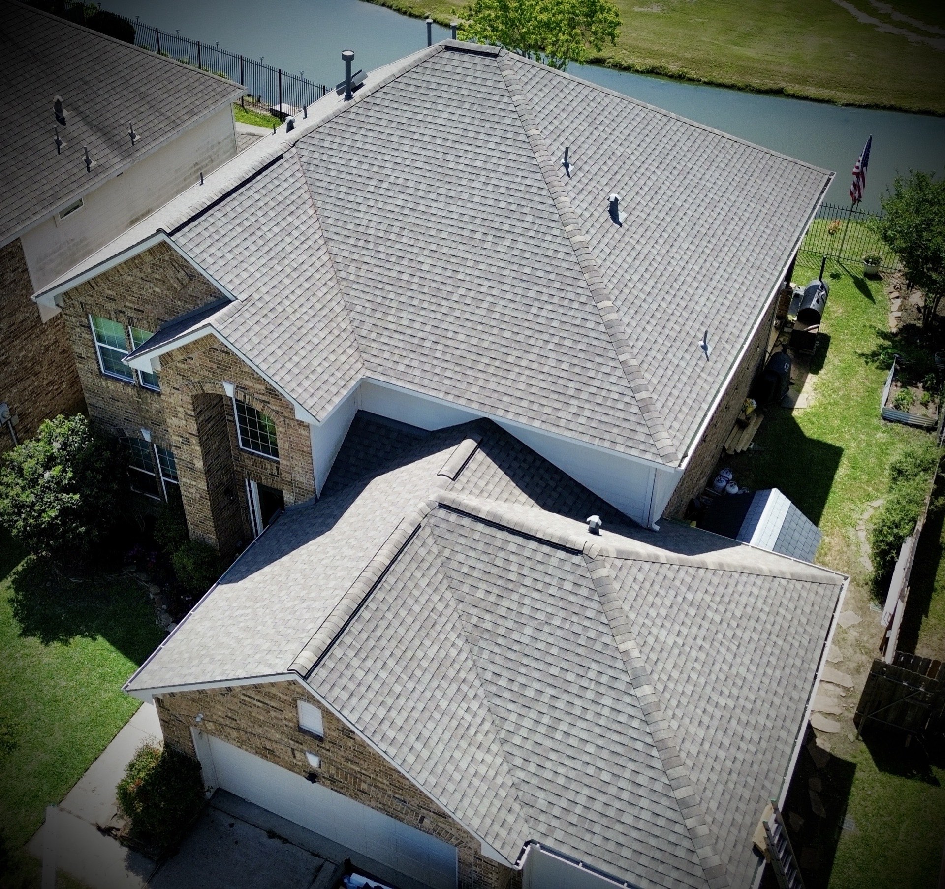 New roof installation on a lakeside home by Recon Roofing